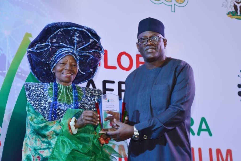 Director, Special Duties, Nigerian Maritime Administration and Safety Agency, NIMASA, Mr Isichei Osamgbi receiving an award on behalf of the Director General, NIMASA, Dr Bashir Yusuf Jamoh, OFR during the Global African Diaspora Symposium in Abuja.

 